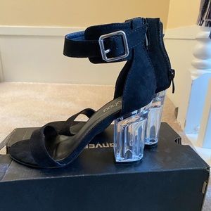 Black strap sandals with clear perspex heels